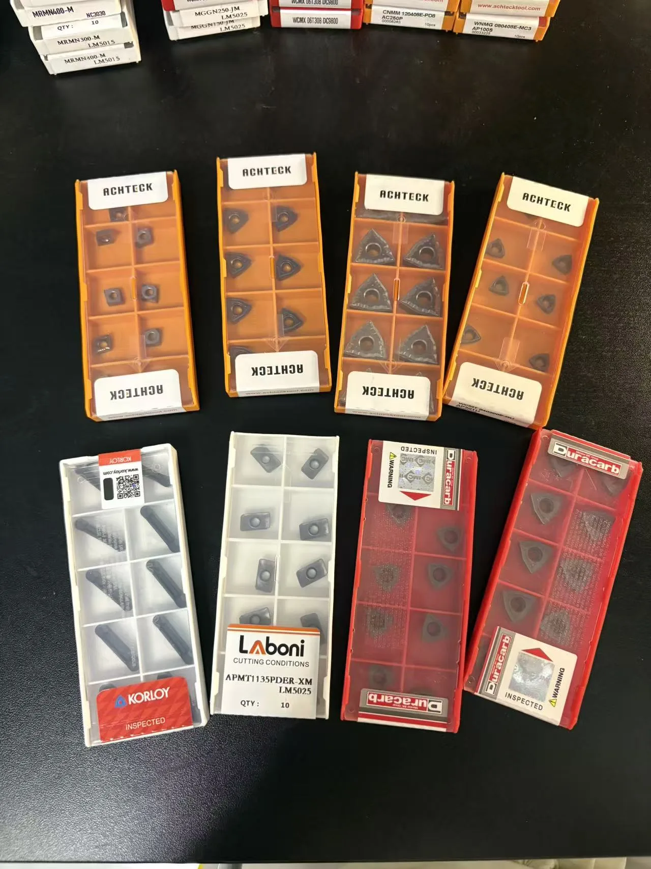 Second view of stocked indexable insert boxes from multiple brands